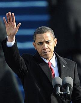 US President Barack Obama waves to the crowd after being sworn in as the 44th US president by Supreme Court Chief Justice John Roberts in front of the Capitol in Washington. Obama gave notice Tuesdsay that an era of economic "greed and irresponsibility" is over as he pledged swift and bold action to kickstart the world's biggest economy.(AFP/Paul J. Richards)