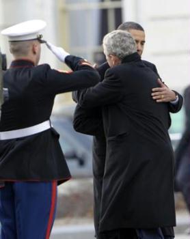 Newly-inaugurated US President Barack Obama (rear) hugs former President George W. Bush (R, front) as Bush departs from the US Capitol after Obama's swearing in as the 44th President of the United States in Washington D.C. Jan. 20, 2009.(Xinhua/Qi Heng)