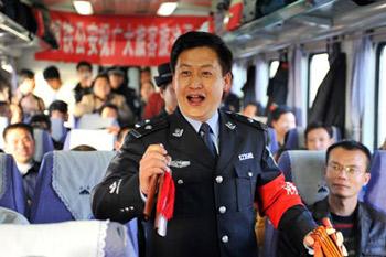 A trainman performs traditional clapper ballad for passengers on the train from Beijing, capital of China, to Yinchuan, capital of northwest China's Ningxia Hui Autonomous Region, Jan. 20, 2009. The 40-day travel peak around the Spring Festival holidays began on Jan. 11, during which some 2.32 billion trips are expected to take place for the Chinese lunar New Year starting from Jan. 26. (Xinhua/Wang Peng)