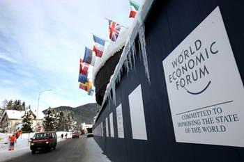 Flags and logo of the World Economic Forum (WEF) are seen at the conference center in Davos, Switzerland, Jan. 26, 2009. (Xinhua Photo)