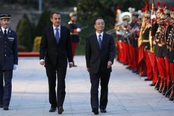 Prime Minister of China Wen Jiabao, right, and Spanish Prime Minister Jose Luis Rodriguez Zapatero, left, review the troops at the Moncloa Palace in Madrid on Friday, Jan. 30, 2009. (AP Photo/Victor R. Caivano)