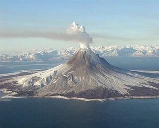 A handout photo from the Alaska Volcano Observatory (AVO)/ Alaska Division of Geological & Geophysical Surveys (ADDGGS) shows a gas plume rising from the Augustine Volcano in Alaska in January 2006. Alaska was on alert Friday as scientists warned that a volcano rumbling near the state's largest city Anchorage was likely to erupt, officials said. (Xinhua/AFP Photo)