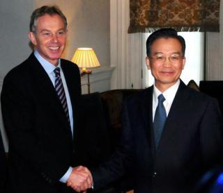 Chinese Premier Wen Jiabao (R) shakes hands with former British Prime Minister Tony Blair during their meeting in London Feb. 1, 2009. Wen is on a three-day official visit to Britain, the last leg of his week-long European tour. (Xinhua/Ma Jianguo)