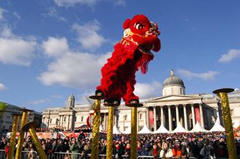 Two actors from China's Guangdong Province perform traditional Chinese lion dance during a Chinese Lunar New Year celebration at Trafalgar Square, London, on Feb. 1, 2009. More than 1,000 actors from China performed nearly 50 programs including songs, dances, martial arts, acrobatics and magic here on Sunday.(Xinhua/Rob Welham)