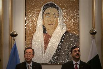 U.N. Secretary-General Ban Ki-moon, left, and Pakistan's Prime Minister Yousuf Raza Gilani, right, are seen next to a portrait of Pakistan's slain former Prime Minister Benazir Bhutto during a joint press conference in Islamabad, Pakistan, Wednesday, Feb. 4, 2009.(AP Photo/Emilio Morenatti)