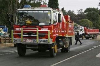 Fire trucks leave the town of Kinglake, 46km (29 miles) north of Melbourne, February 11, 2009. Cooler weather helped thousands of firefighters begin to get a grip on Australia's deadliest bushfires on Wednesday but 181 people were confirmed dead in parts of the southeast devastated by the infernos.REUTERS/Daniel Munoz
