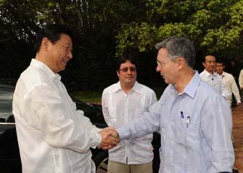Visiting Chinese Vice President Xi Jinping meets with Colombian President Alvaro Uribe in Cartagena, a port city of Colombia, on Feb. 15, 2009. (Xinhua/Ma Zhancheng)