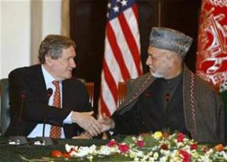 Afghanistan's President Hamid Karzai (R) shakes hand with U.S. Special Representative to Pakistan and Afghanistan Richard Holbrooke in Kabul February 15, 2009.(Omar Sobhani/Reuters)