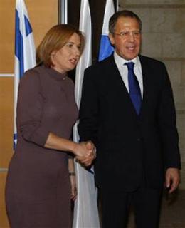 Israel's Foreign Minister Tzipi Livni, left, shakes hands with Russian Foreign Minister Sergey Lavrov, right, during their meeting at the Foreign Ministry in Jerusalem, Sunday, Feb. 15, 2008. (AP Photo/Dan Balilty)