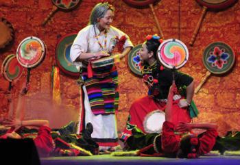 Tibetan artists in traditional costumes stage Tibetan dance during a rehearsal for the grand party scheduled to open on Feb. 24 to celebrate the upcoming Tibetan New Year, the year of Ox, in Lhasa, capital of sotuhwest China's Tibet Autonomous Region, Feb. 14, 2009. (Xinhua/Jia Lijun) 