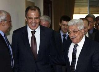 Palestinian President Mahmoud Abbas (R) walks with Russia's Foreign Minister Sergei Lavrov during their meeting in the West Bank city of Ramallah February 16, 2009. REUTERS/Omar Rashidi/PPO/Handout