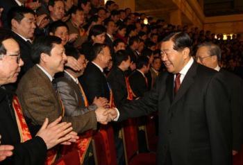 Jia Qinglin (R, front), member of the Standing Committee of the Political Bureau of the Communist Party of China (CPC) Central Committee and chairman of the National Committee of the Chinese People's Political Consultative Conference (CPPCC), meets with the delegates and representatives of the model workers and the advanced collectives of the national machinery industry, at the Great Hall of the People in Beijing, China, Feb. 19, 2009.((Xinhua Photo)