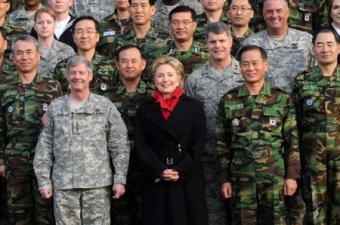U.S. Secretary of State Hillary Clinton (C, 1st row) poses for photos with Gen. Walter Sharp (1st L, 1st row), the commander of U.S. Forces Korea, and officers during her visit at Yongsan Garrison in Seoul, on Feb. 20, 2009.(Xinhua Photo)