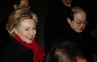 U.S. Secretary of State Hillary Clinton (L) walks with Chinese Assistant Foreign Minister Liu Jieyi upon arrival at Beijing airport February 20, 2009.  (Greg Baker/Pool/Reuters)