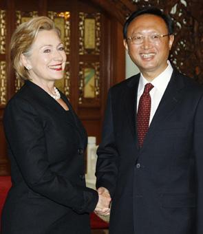 US Secretary of State Hillary Clinton (L) is greeted by Chinese Foreign Minister Yang Jiechi in Beijing February 21, 2009.[Agencies]