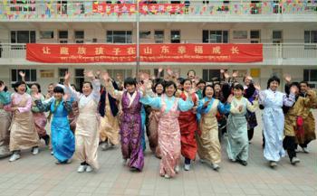 Tibetan students celebrate the Tibetan New Year which falls on Feb. 25 this year at Jinan Tibetan School in Jinan, capital of east China's Shandong Province, Feb. 24, 2009. Some 200 Tibetan students who study in the coastal province welcomed Tibetan New Year on Tuesday.(Xinhua/Fan Changguo)