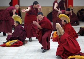 Tibetan monks take part in religious exercises at a monastery near Tongren, northwest China's Qinghai province February 24, 2009, a day before the ethnic Tibetan traditional new year, which varies from year to year and begins on Wednesday this year. [Photo: China Daily/Agencies]