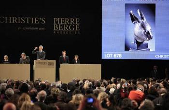 The bronze sculpture of a rabbit's head, which is an ancient Chinese relic, is auctioned in the Grand Palace of Paris in Paris, France, Feb. 25, 2009. Two controversial ancient Chinese relics including the bronze sculptures of a rat's head and a rabbit's head, were auctioned off on Wednesday night for 14 million euros each by anonymous telephone bidders in Christies's sale of the collection of Yves Saint Laurant and Pierre Berge in Paris. The sculptures were looted by invading Anglo-French expedition army in the 19th century, when the invaders burned down the royal garden of Yuanmingyuan in Beijing.(Xinhua/Zhang Yuwei)
