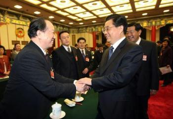 Chinese President Hu Jintao (2nd R), shakes hands with a member of the 11th National Committee of the Chinese People's Political Consultative Conference (CPPCC) in Beijing, capital of China, March 4, 2009. Hu Jintao and Jia Qinglin (1st R), member of the Standing Committee of the Political Bureau of the Communist Party of China (CPC) Central Committee and also chairman of the National Committee of the Chinese People's Political Consultative Conference (CPPCC), visited the CPPCC members from the China Association for Promoting Democracy and the China Democratic League on Wednesday. (Xinhua Photo)