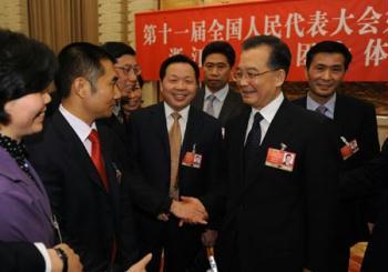 Chinese Premier Wen Jiabao (2nd R) joins a panel discussion with deputies to the Second Session of the 11th National People's Congress (NPC) from east China's Zhejiang Province, in Beijing, capital of China, March 9, 2009. (Xinhua/Huang Jingwen)