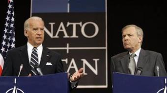 U.S. Vice President Joe Biden, left, gestures while speaking during a media conference at NATO headquarters in Brussels, Tuesday March 10, 2009.(AP Photo/Virginia Mayo)