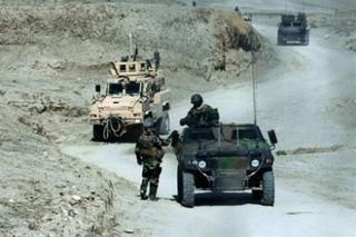 French and US patrol vehicles under NATo-Command move in convoy near Tagab city in Afghanistan's Kapisa province in February.(AFP/File/Joel Saget)
