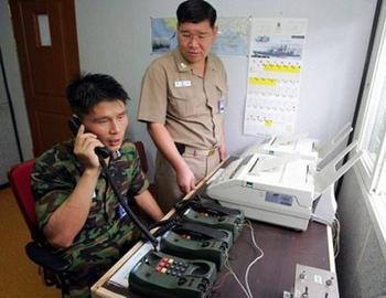 A South Korean officer on the phone in Paju, about 55 kms north of Seoul. North Korea Saturday reconnected cross-border military phone lines and reopened the border for South Koreans visiting an industrial complex, the Unification Ministry here said(AFP/File/You Sung-Ho)  