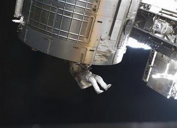 In this photo released by NASA, space shuttle Discovery astronaut Steve Swanson participates in the mission's second scheduled session of extravehicular activity (EVA) as construction and maintenance continue on the international space station, Saturday March 21, 2009.(AP Photo/NASA)