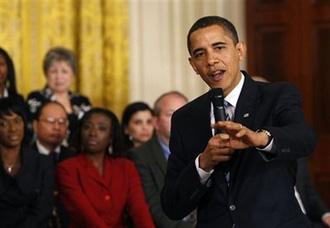 US President Barack Obama holds an 'Open For Questions' town hall style meeting in the East Room of the White House in Washington, Thursday, March 26, 2009.(AP Photo/Gerald Herbert)