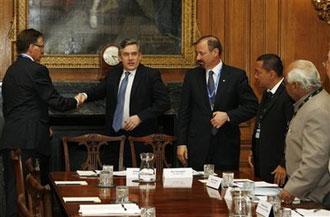 Britain Prime Minister Gordon Brown, second left, greets representatives of G20 countries' Trade Unions, during a round table discussion at 10 Downing Street in London, Tuesday, March 31, 2009.(AP Photo/Sang Tan, Pool)