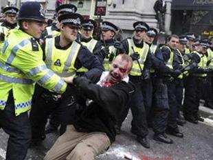 Police and a demonstrator clash in London April 1, 2009.REUTERS/Stringer