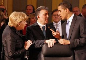 Angela Merkel (L) and US President Barack Obama talk before a working dinner at Baden-Baden City hall. NATO leaders were to hold formal strategy talks Saturday as their 60th anniversary meeting went into a second and final day amid disagreement over the future secretary general of the alliance.(DDP/AFP/Michael Urban)