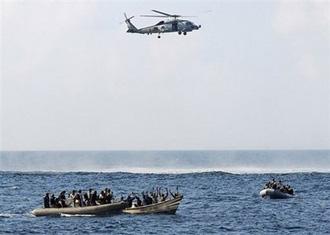 A US Navy helicopter from the guided-missile cruiser USS Vella Gulf closes in on suspected pirates in the Gulf of Aden in February 2009.(AFP/US Navy/File/Jason R. Zalasky)