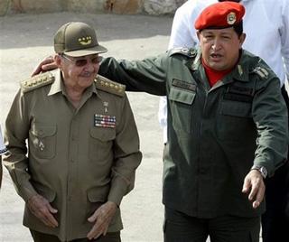 Venezuela's President Hugo Chavez, right, and Cuba's President Raul Castro, left, joke prior to the official photo during the Bolivarian Alternative for the Americas, or ALBA, Summit in Cumana, Venezuela, Thursday, April 16, 2009.(AP Photo/Fernando Vergara)