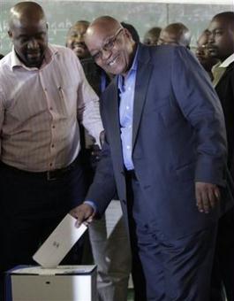African National Congress (ANC) president Jacob Zuma, right, casts his ballot at the Ntolwane primary school in the village of Kwanxamabala, South Africa, Wednesday, April 22, 2009. Voters lined up before sunrise Wednesday in an election that has generated an excitement not seen since South Africa's first multiracial vote in 1994, and that was expected to propel Jacob Zuma to the presidency after he survived corruption and sex scandals.(AP Photo/Jerome Delay)
