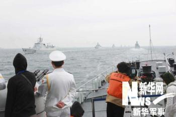 China kicks off naval parade to mark PLA Navy 60th anniversary.
