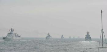 Naval warships are seen during a naval parade of the Chinese People's Liberation Army (PLA) Navy warships and aircraft in waters off China's port city of Qingdao, east China's Shandong Province, on April 23, 2009. (Xinhua/Li Gang)