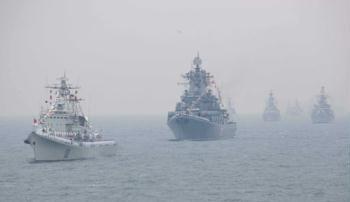 Chinese People's Liberation Army (PLA) Navy vessels attend a naval parade of the PLA Navy warships and aircraft in waters off Qingdao, east China's Shandong Province, on April 23, 2009. (Xinhua/Wang Jianmin) 