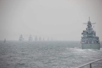 A naval parade of the Chinese People's Liberation Army (PLA) Navy warships and aircraft is held in waters off China's port city of Qingdao, east China's Shandong Province, on April 23, 2009. (Xinhua/Li Gang)