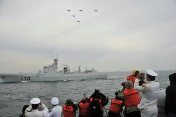 A naval parade of the Chinese People's Liberation Army (PLA) Navy warships and aircraft is held in waters off China's port city of Qingdao, east China's Shandong Province, on April 23, 2009. The parade displays 25 naval vessels and 31 aircraft of the PLA Navy, including at least one of the country's nuclear submarines, as part of a celebration to mark the 60th anniversary of the founding of the PLA Navy. An international fleet inspection involving 21 foreign vessels from 14 countries will be held after the PLA naval parade. (Xinhua/Li Gang)
