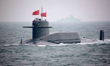 A nuclear submarine of the Chinese People's Liberation Army (PLA) Navy is seen during a naval parade of the PLA Navy warships and aircraft in waters off China's port city of Qingdao, east China's Shandong Province, on April 23, 2009. A Chinese officer introduces Chinese naval submarine to heads of delegations of foreign navies at Qingdao port, east China's Shandong Province, on April 22, 2009. (Xinhua/Li Gang)