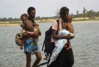 Thu Apr 23, 3:17 AM ET In this photograph released by the Sri Lankan navy April 22, 2009, a Tamil man and woman carry children after fleeing an area called the 'No Fire Zone' controlled by the Liberation Tigers of Tamil Eelam(LTTE), in northern Sri Lanka.REUTERS/Sri Lankan Government/Handout
