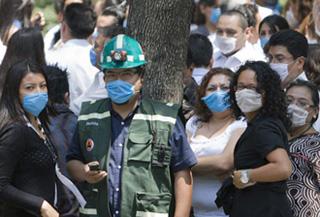 People wearing masks gather outside buildings after an earthquake in Mexico City, captial of Mexico, April 27, 2009. A 5.6-magnitude earthquake hit southern Mexico on Monday at 11:46 a.m. local time, with an epicenter 23 kilometers northeast of Zumpango, a small town in the state of Guerrero, and with a deepness of 41.2 kilometers, the U.S. Geological Survey Earthquake Hazards Program reported. The quake was felt in Mexico City. (Xinhua/David de la paz)