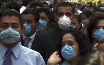 People wear surgical face masks as they gather outside of buildings after earthquake in Mexico City April 27, 2009.REUTERS/Eliana Aponte