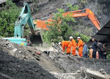 Two landslides claimed fourteen lives in southwestern China's Yunnan province on Sunday. One landslide was the result of an industrial accident, while the other was a natural disaster.
