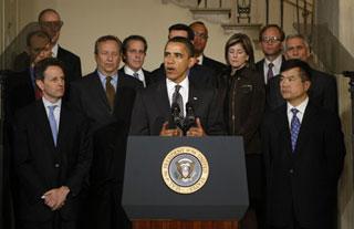 U.S. President Barack Obama (C) speaks about Chrysler and the auto industry, as he stands with his auto task force at the White House in Washington April 30, 2009. (Xinhua/Reuters Photo)