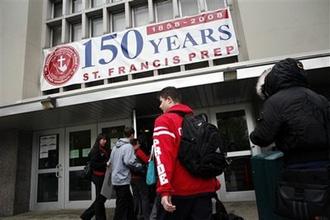 Students return to class at St. Francis Prep high school Monday, May 4, 2009 in the Queens borough of New York. St. Francis Prep was closed last week after the school was linked to an outbreak of swine flu.(AP Photo/Jason DeCrow)