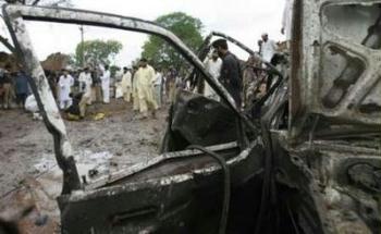 Security officials gather to collect evidence at the site of a suicide blast near Peshawar May 5, 2009. At least four security men were killed in a car bomb attack near Pakistan's main northwestern city of Peshawar on Tuesday, police said.