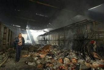 A local U.N. worker stands inside the United Nations compound that was struck by Israeli fire, during the visit of U.N. Secretary-General Ban Ki-moon (not pictured) in Gaza City in this January 20, 2009 file photo.REUTERS/Suhaib Salem/Files