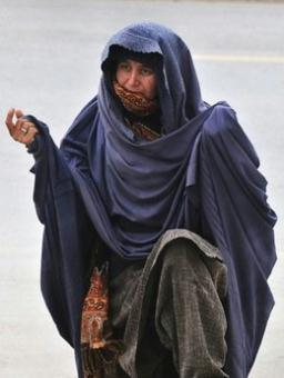 A Swati woman waits for relatives at the bus stand upon arrival from the Swat district. Panicked civilians fled Pakistan's Swat district on Tuesday as the government prepared to shelter 500,000 displaced people and clashes with Taliban fighters heightened fears that a peace deal was about to collapse.(AFP/Farooq Naeem)